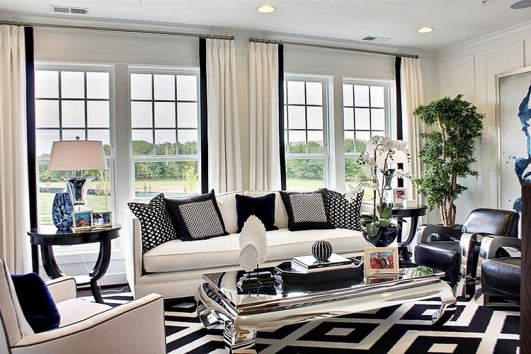 Black white and blue shape a refined family room with mirrored center table ideas home inspiration ideas